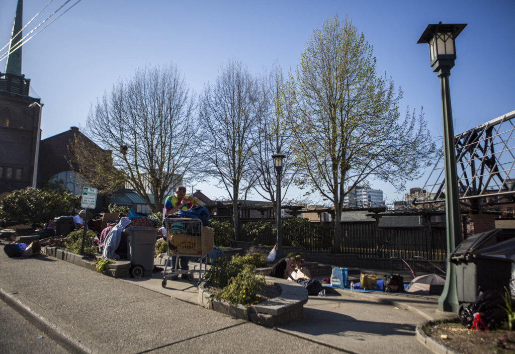 People convene at Matthew Parsons Park at a homeless camp on Monday in Everett. (Olivia Vanni / The Herald) 
