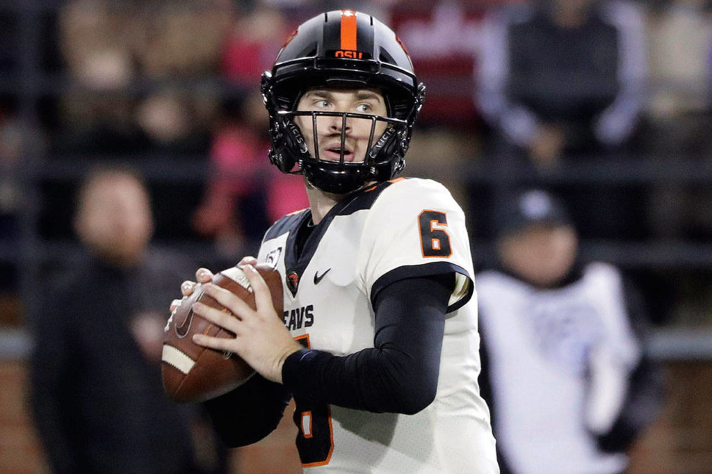 Oregon State quarterback Jake Luton, a Marysville Pilchuck alum, looks for a receiver during a game against Washington State on Nov. 23, 2019, in Pullman. (AP Photo/Ted S. Warren)
