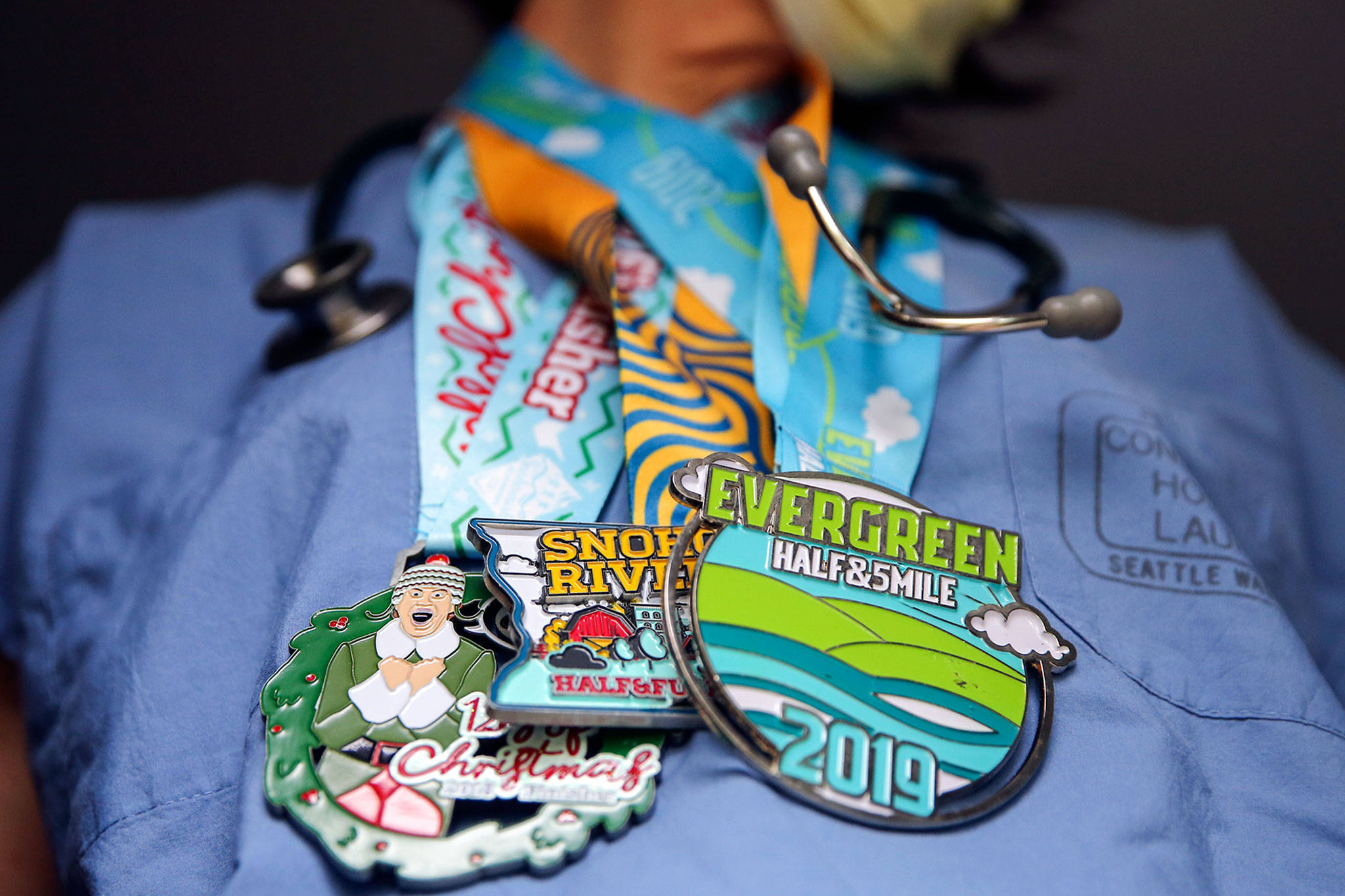 Snohomish Running Co.’s Run For Campaign enables people to donate to charity and then send an unused medal from a cancelled run to the essential worker of a donor’s choice — as a sign of appreciation. (Kevin Clark / The Herald)
