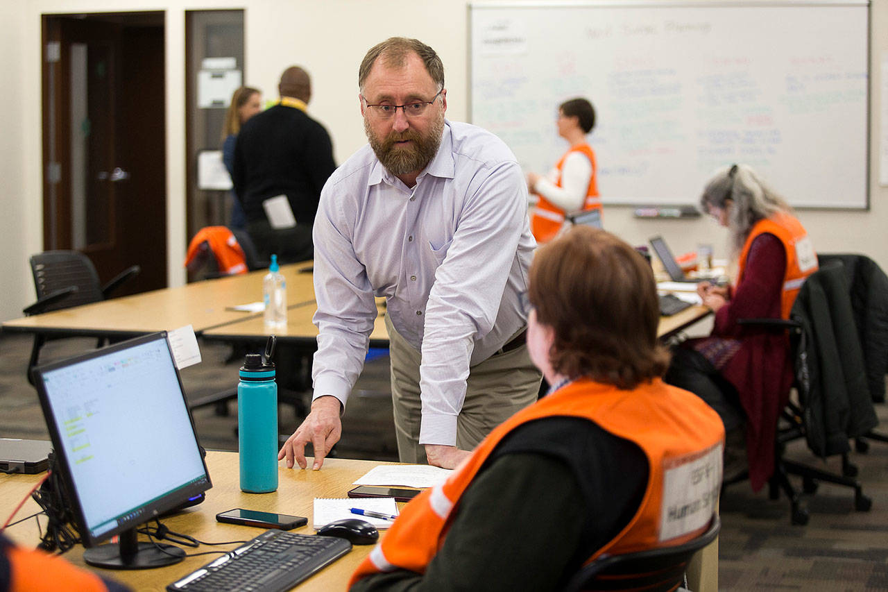 Jason Biermann, Snohomish County Department of Emergency Management director, said there’s no magic number that shows when the county is ready to reopen. Biermann is shown here at a March 30 crisis response meeting at the Snohomish County Emergency Management Center in Everett. (Andy Bronson / Herald file)