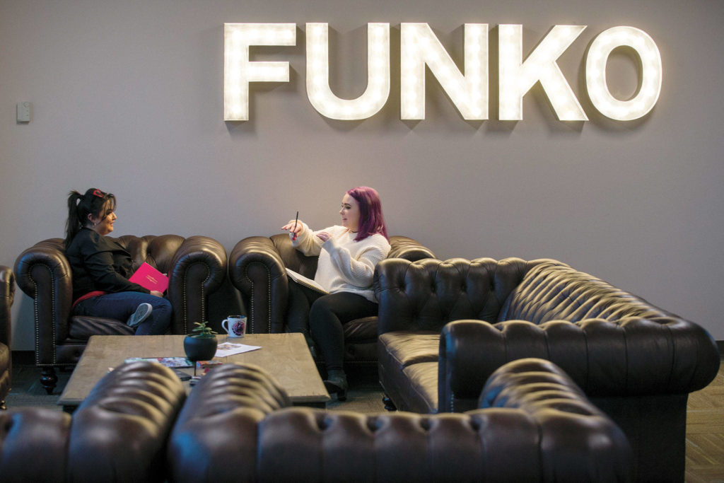 Packaging designers Jessica Nanez and Gwen Machan discuss ideas in the employee cafeteria at Funko headquarters before the coronavirus shutdown. (Andy Bronson / The Herald)
