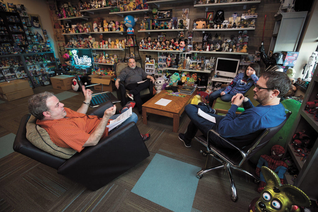 Surrounded by the company’s products, Funko Creative Director Sean Wilkinson (left) meets before the coronavirus shutdown with (from left) Eddie Iziarry, Darcy Harlen and Gary Ham. (Andy Bronson / The Herald)
