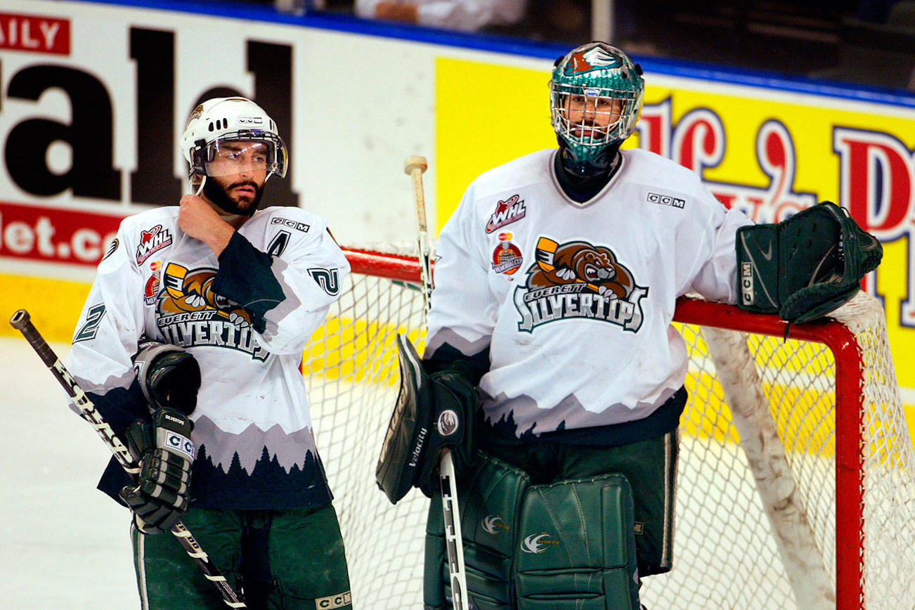 Everett Silvertips players Mitch Love (left) and Jeff Harvey face the Medicine Hat Tigers during the 2004 WHL championship series. (Michael O’Leary / The Herald)