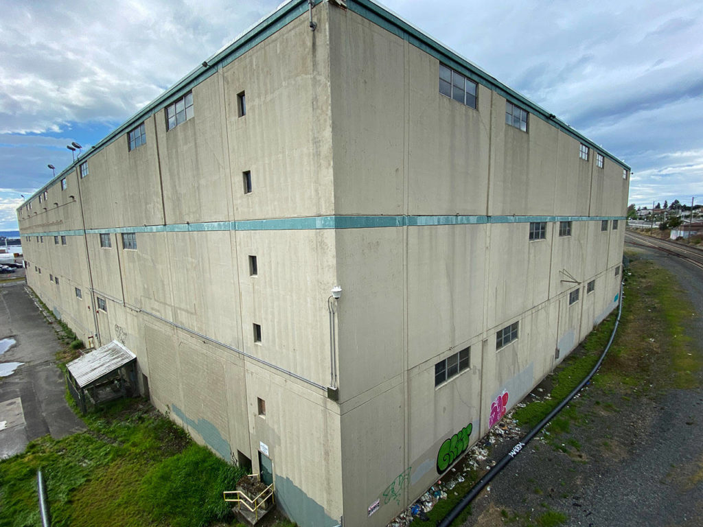 The old Kimberly-Clark warehouse on the Everett waterfront is seen April 29. (Sue Misao / The Herald)
