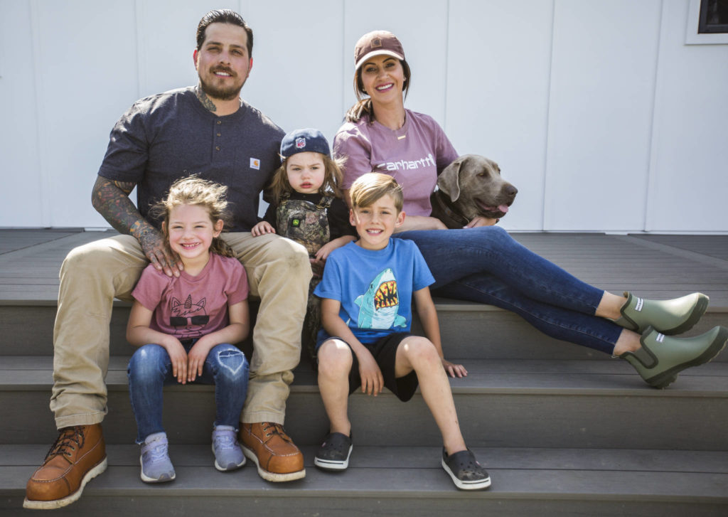 At their home on Pemberton Farm in Snohomish are James Tarin (top left) and Nicole Tarin (top right) with their children (from left) Saylor, 4, River, 2, Jameson, 6, and dog Trigger. A new wedding venue, the farm’s first event won’t be until August due to the governor’s stay-home order. (Olivia Vanni / The Herald)
