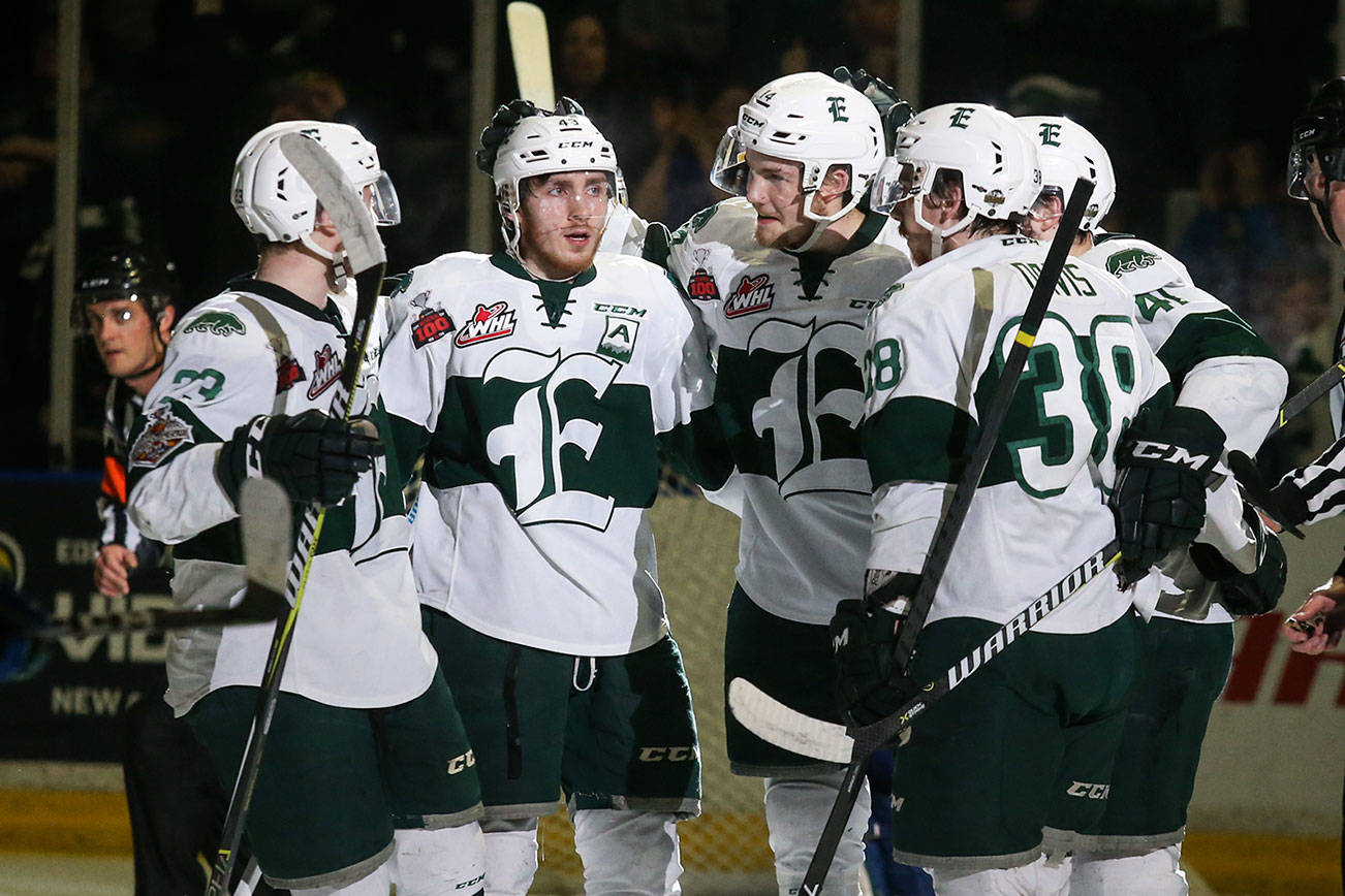 The Everett Silvertips celebrate a goal by Riley Sutter, center, during Game 3 of the 2018 WHL finals at Angel of the Winds Arena. (Andy Bronson / The Herald)