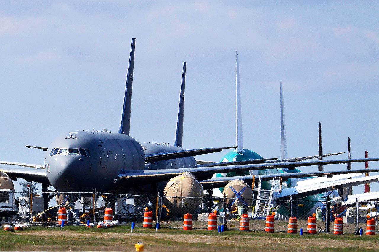 In this April 7 photo, U.S. Air Force KC-46 tankers being built by Boeing sit parked at the Paine Field airport in Everett. (AP Photo/Ted S. Warren, File)