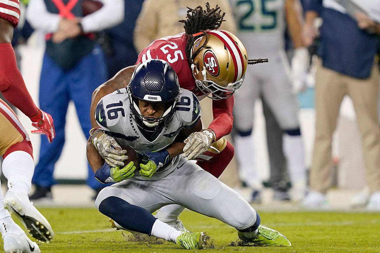 San Francisco 49ers cornerback Richard Sherman (25) tackles Seattle Seahawks wide receiver Tyler Lockett (16) during the Seahawks’ 27-24 overtime victory last November at Levi’s Stadium. (AP Photo/Tony Avelar)
