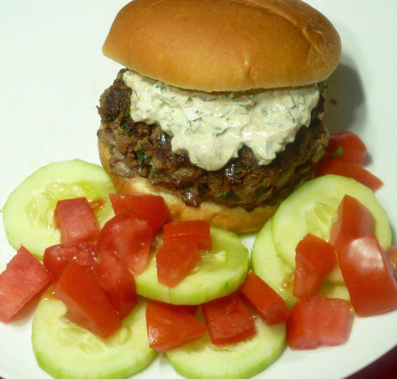 Top each Moroccan burger with an herbed and spiced yogurt sauce. (Linda Gassenheimer)