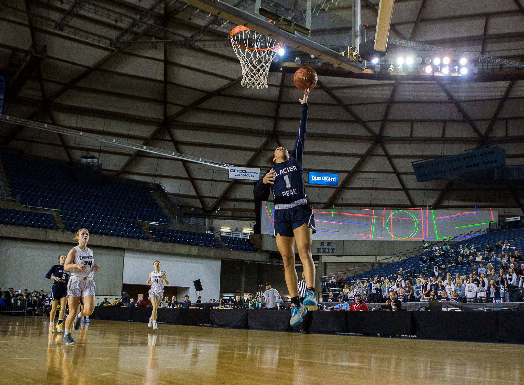 Glacier Peak’s Aaliyah Collins makes a layup after stealing the ball during a Hardwood Classic quarterfinal game against Chiawana on March 5, 2020, at the Tacoma Dome. (Olivia Vanni / The Herald)