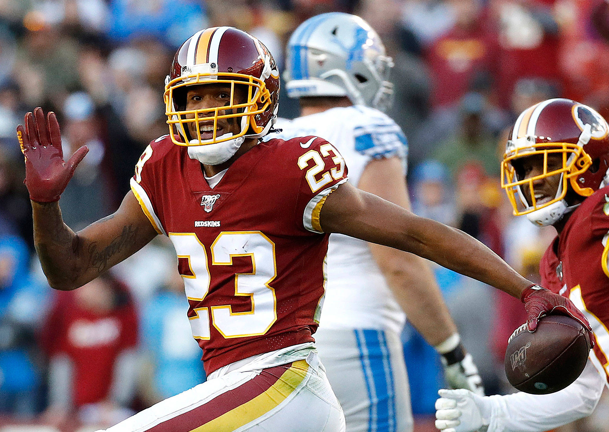 Then Redskins cornerback Quinton Dunbar (23) reacts after intercepting a pass from Lions quarterback Jeff Driskel during the second half of a game on Nov. 24, 2019, in Landover, Md. Dunbar was traded to the Seahawks in March. (AP Photo/Patrick Semansky)