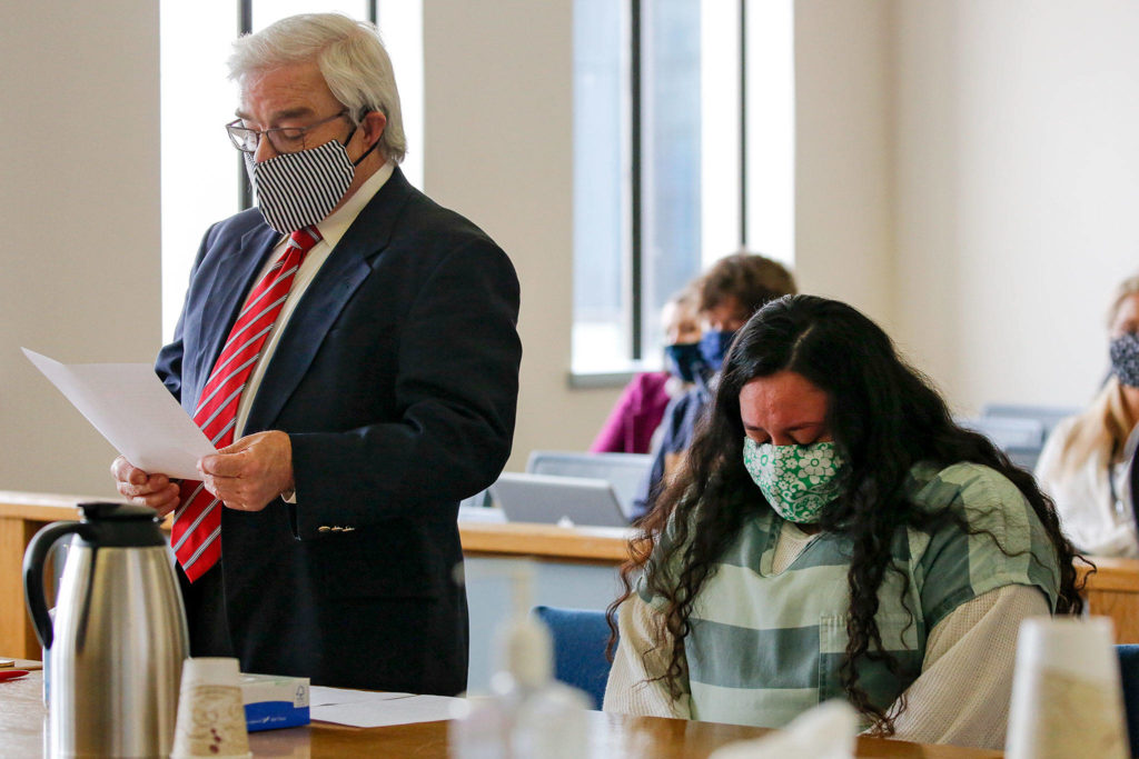 Walter Peale reads Lendsay Meza’s statement during her sentencing Thursday afternoon at the Snohomish County Courthouse in Everett. (Kevin Clark / The Herald)
