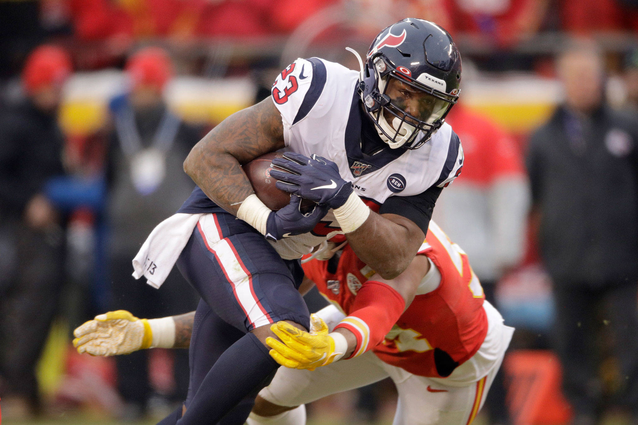 Former Texans running back Carlos Hyde (23) carries the ball during the first half of a playoff football game against the Chiefs on Jan. 12, 2020, in Kansas City, Mo. Hyde reportedly agreed to a deal with the Seahawks on Friday. (AP Photo/Charlie Riedel)