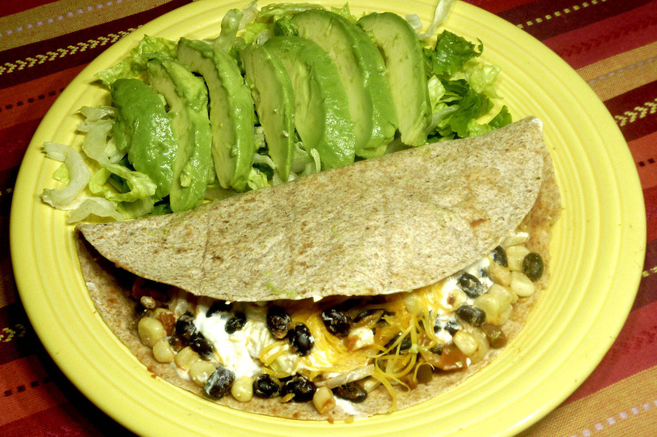 Vegetarian tacos wrapped in whole-wheat tortillas are a healthful way to enjoy a national favorite (Dreamstime)