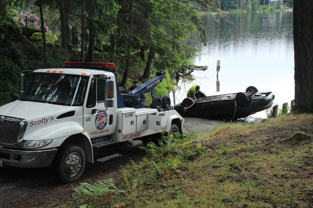 A Ford Taurus was pulled from the muddy depths of Goss Lake on May 21. (Whidbey News-Times)
