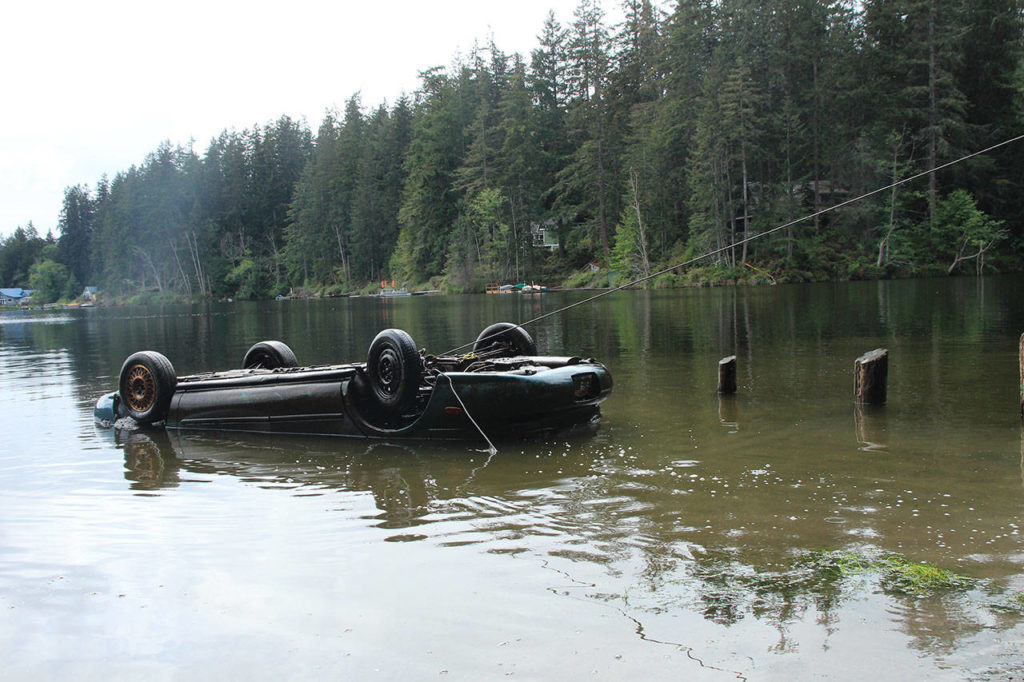 A Ford Taurus was pulled from the muddy depths of Goss Lake on May 21. (Whidbey News-Times)
