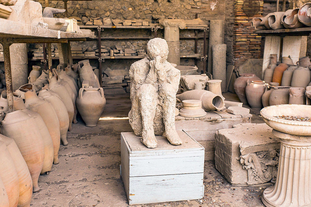 Pompeii’s most compelling scenes are its (permanent) residents, whose plaster-cast remains are amazingly detailed, revealing clothing features and facial expressions. (Addie Mannan / Rick Steves’ Europe)
