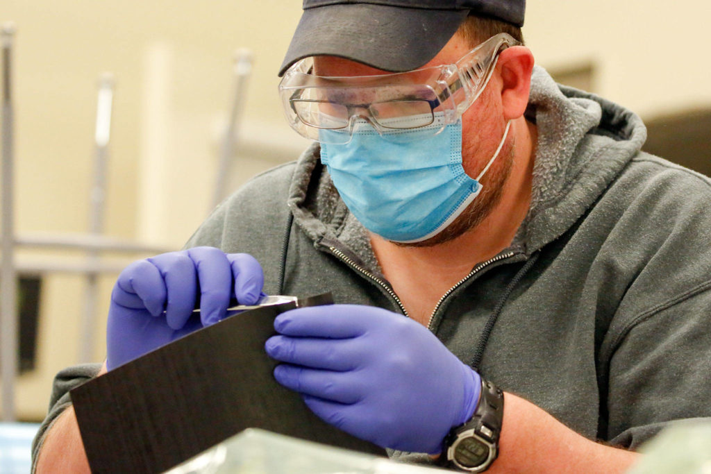 Brendan Fellows works on an assignment at the Advanced Manufacturing Training & Education Center at Everett Community College. (Kevin Clark / The Herald) 
