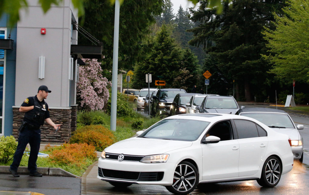 Traffic snaked around the corner for the Marysville Chick-fil-A grand opening on May 21. Police continue to direct traffic during the lunch and dinner hours. (Kevin Clark / The Herald)
