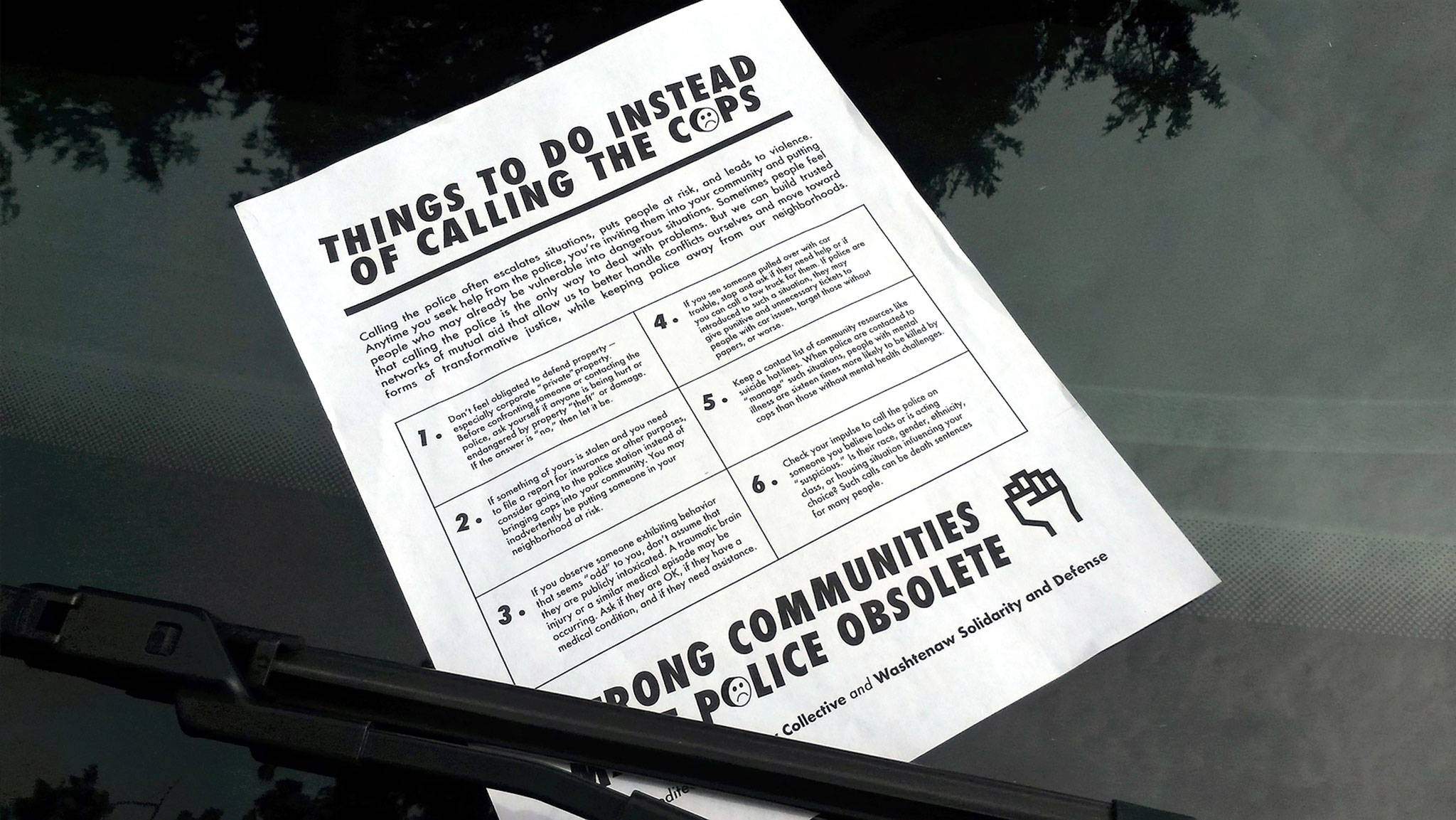 This flier, with content credited to the May Day Collective and Washtenaw Solidarity and Defense, was left on windshields of cars in north Everett on Saturday. It suggests that individuals handle conflicts rather than calling police, even if property is damaged or taken. (Julie Muhlstein / The Herald)