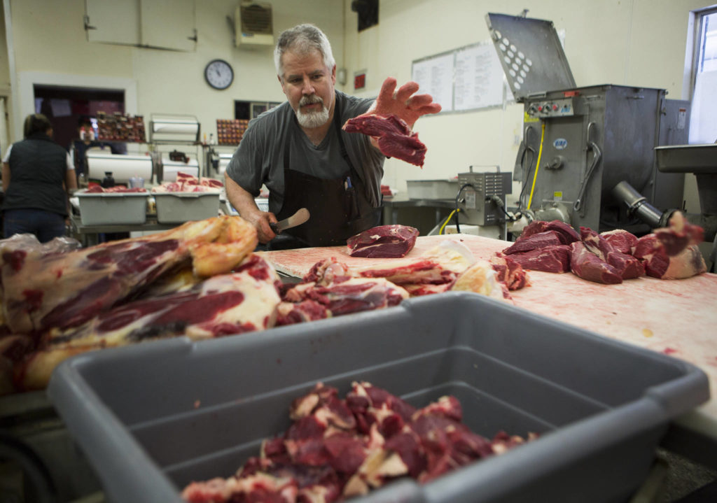 Mike Parker processes beef at Silvana Meats on Friday, May 29, 2020 in Silvana, Wa. (Olivia Vanni / The Herald)
