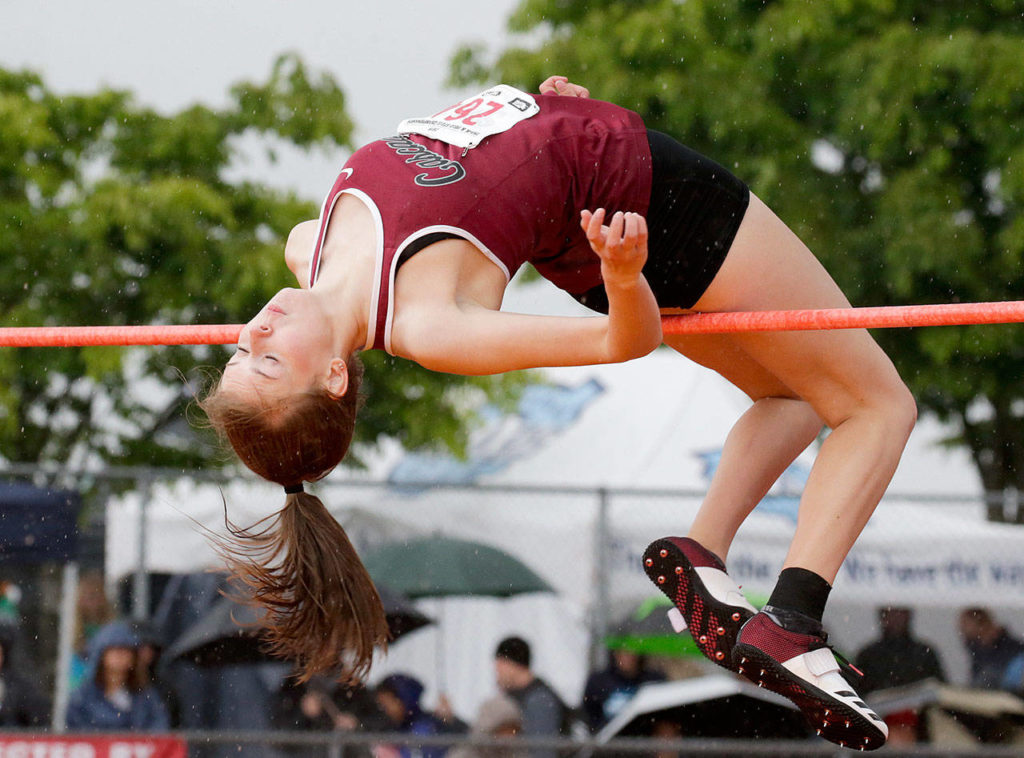 Cascade’s Katie Nelson clears the high bar during the state track and field finals on May 25, 2019, in Tacoma. (Andy Bronson / The Herald)
