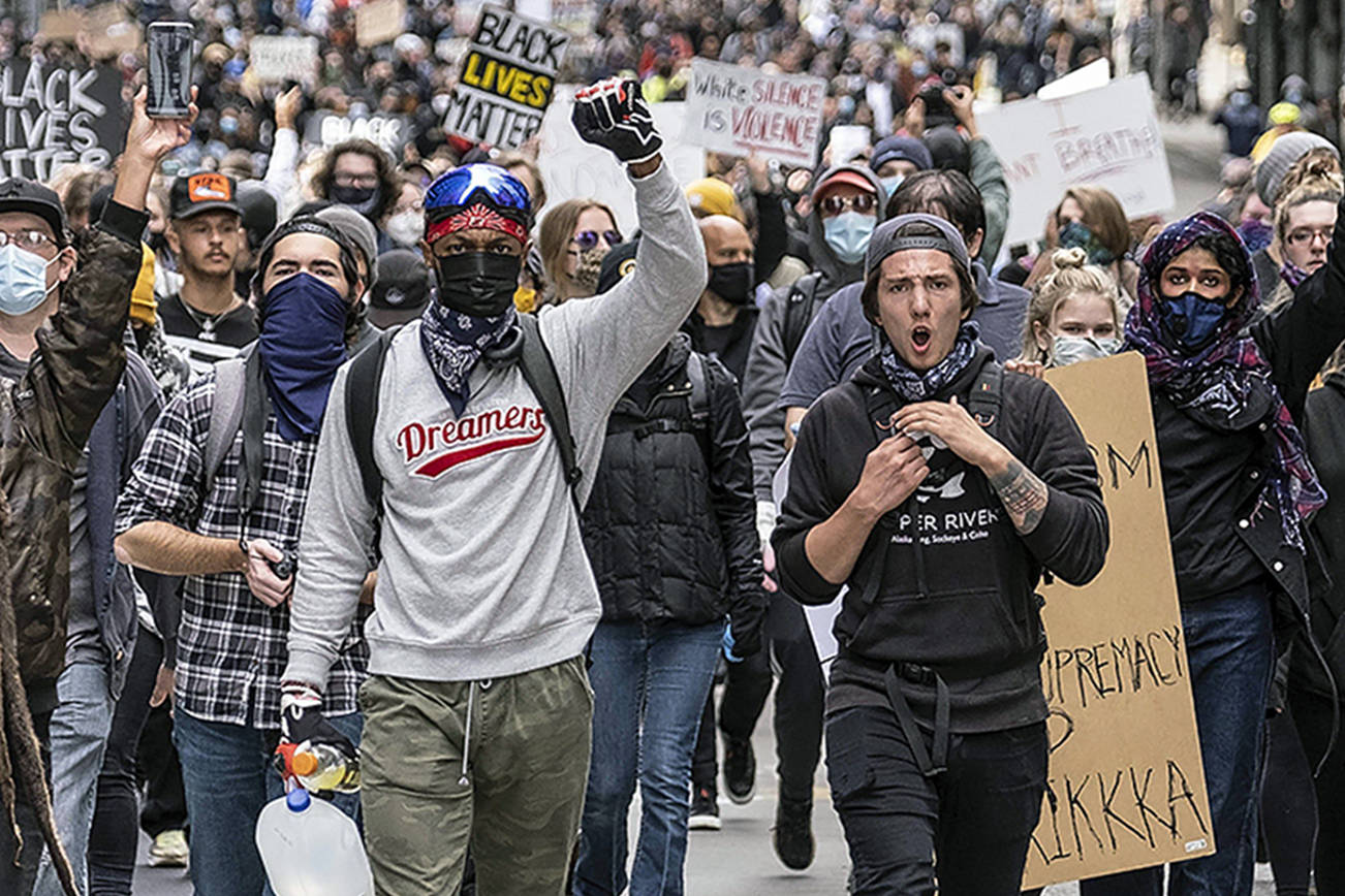Inslee embraces peaceful demonstrators, condemns looters