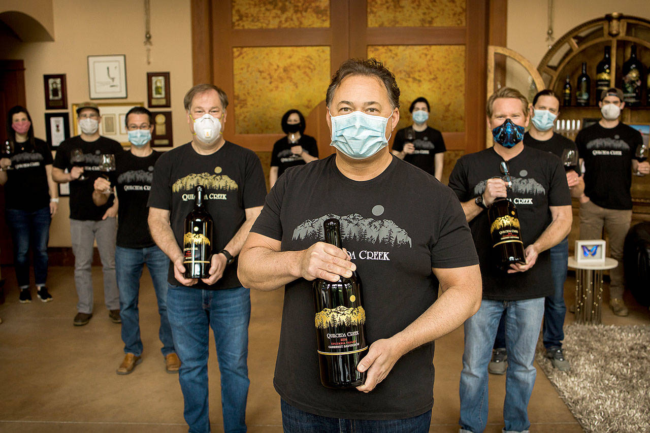 Quilceda Creek Vintners, one of Washington’s oldest family-owned wineries, donated $365,000 to out-of-work restaurant employees. Holding 3-liter bottles are (from left) Bill Reith, CFO; Paul Golitzin, president and director of winemaking; and Scott Lloyd, general manager. (Quilceda Creek Vintners)