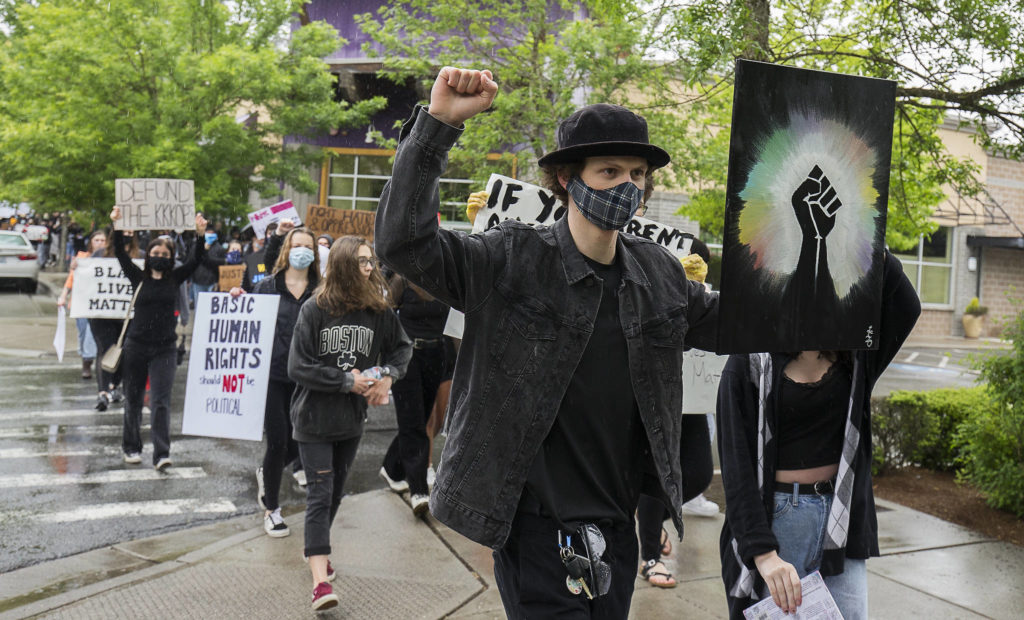 About two hundred protesters marched though Mill Creek, to protest the killing of George Floyd, on Tuesday, June 2, 2020 in Mill Creek, Wa. (Andy Bronson / The Herald)
