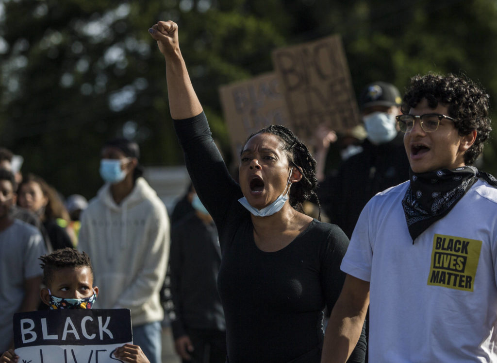 Hazzauna Underwood leads the crowd in a chant during the Black Lives Matter protest on Sunday in Mukilteo. (Olivia Vanni / The Herald)
