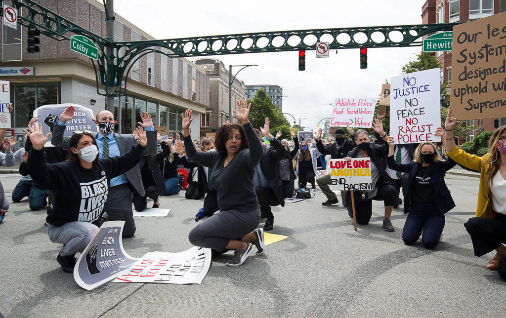 Members of the Snohomish County Public Defender Association and others marched through north Everett on Monday with the Black Lives Matter movement to call attention to the death of George Floyd. (Andy Bronson / The Herald)
