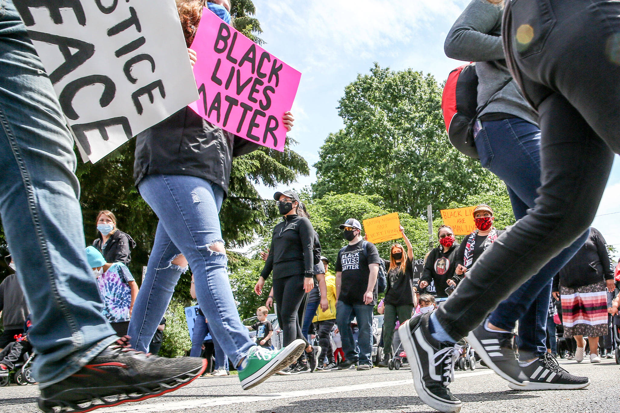 Hundreds marched through Marysville on Thursday, in a demonstration organized by students, the YMCA of Snohomish County, the city of Marysville, the Tulalip Tribes and more. (Kevin Clark / The Herald)