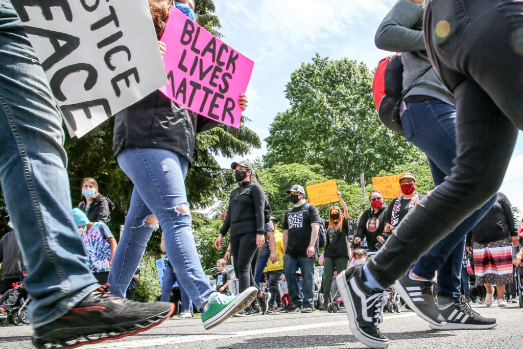 Hundreds marched through Marysville on Thursday, in a demonstration organized by students, the YMCA of Snohomish County, the city of Marysville, the Tulalip Tribes and more. (Kevin Clark / The Herald)
