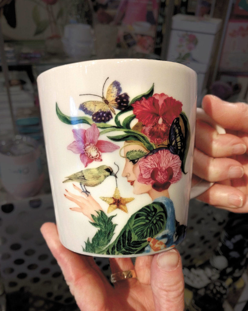 Judy Matheson attends trade shows and scours catalogs to find merchandise such as this La Flora mug. (Dan Bates / The Herald)

