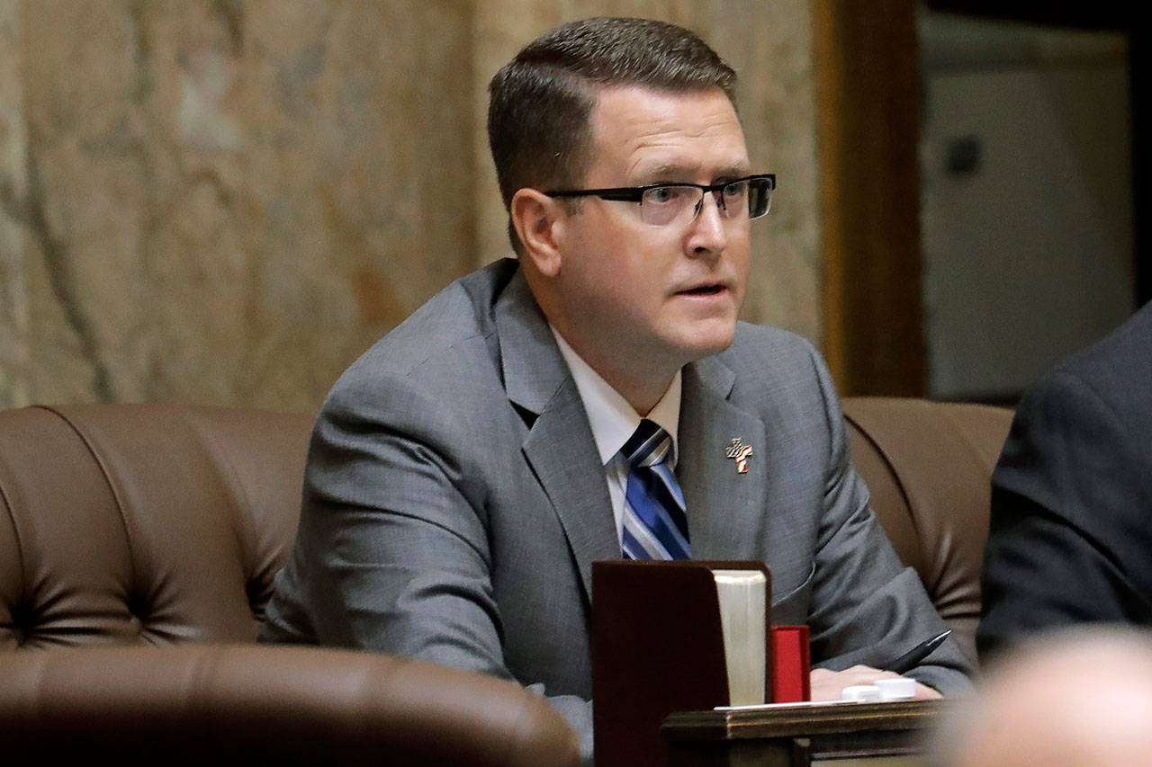 In this Feb. 19 photo, state Rep. Matt Shea, R-Spokane Valley, listens to testimony on the House floor at the Capitol in Olympia. (AP Photo/Ted S. Warren, File)