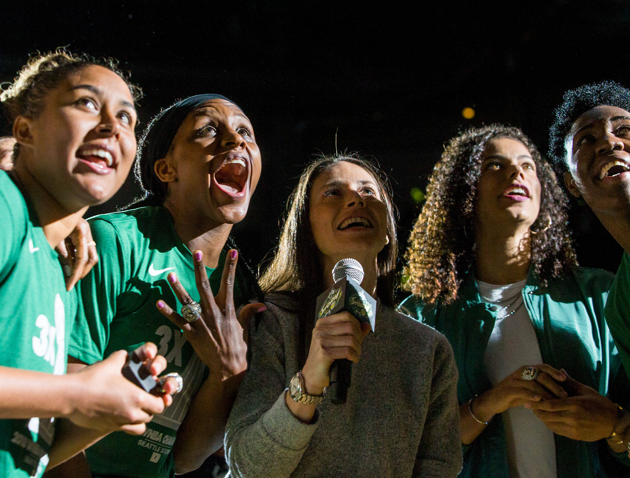 Seattle Storm players (from left) Kaleena Mosqueda-Lewis, Crystal Langhorne, Sue Bird, Alysha Clark and Natasha Howard react to their championship banner being revealed during a pregame ceremony in May 2019 at Angel of the Winds Arena in Everett. Because of the pandemic, the Storm won’t be playing any games in Everett this year. (Olivia Vanni / Herald file)