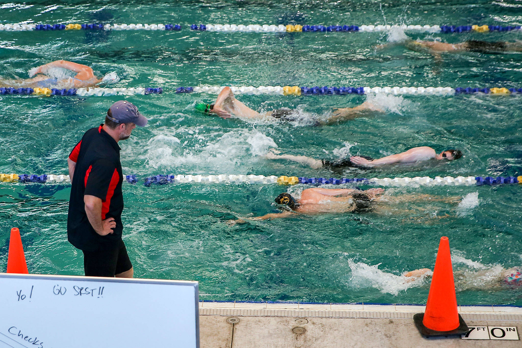 Ben Olszewski leads a practice of the StingRay Swim Team at Snohomish Aquatic Center Wednesday afternoon in Snohomish. (Kevin Clark / The Herald)