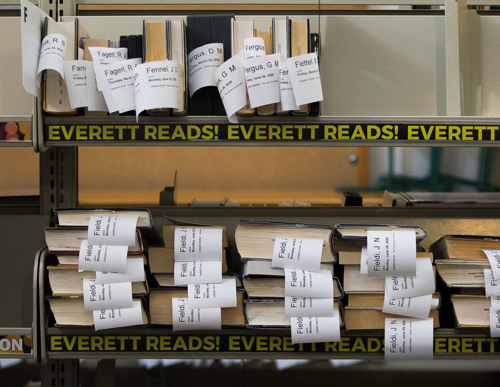 Books are filed alphabetically and ready for curbside pick-up at the Everett Public Library on Wednesday. (Andy Bronson / The Herald)
