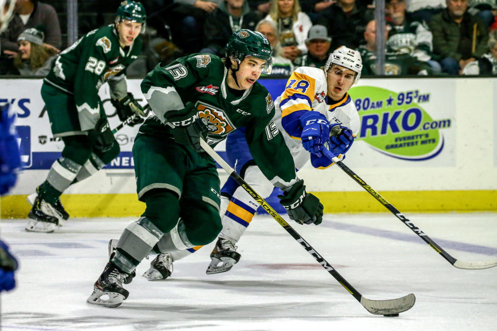 The Silvertips’ Brendan Lee controls the puck with the Blades’ Matej Toman defending during a game on Nov. 22, 2019, at Angel of the Winds Arena in Everett. (Kevin Clark / The Herald)
