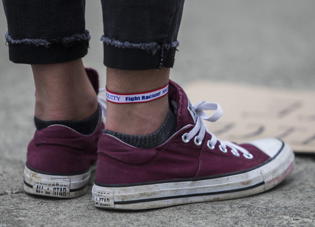 Anjuli Kajla, wares a Fight Racism ankle band during the Juneteenth protest on Friday, June 19, 2020 in Snohomish, Wa. (Olivia Vanni / The Herald)
