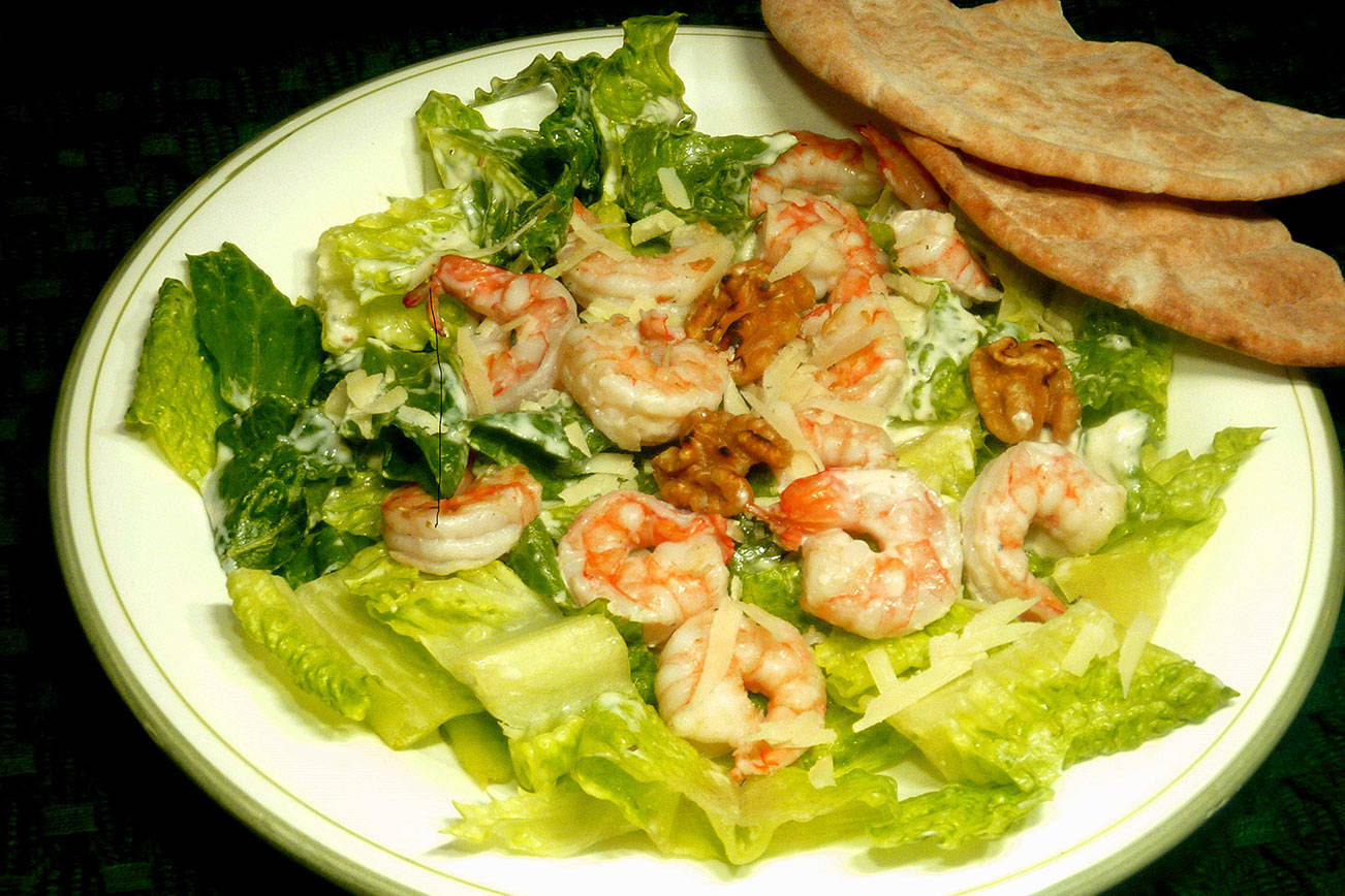 Elevate classic the Caesar salad with grilled shrimp, walnuts