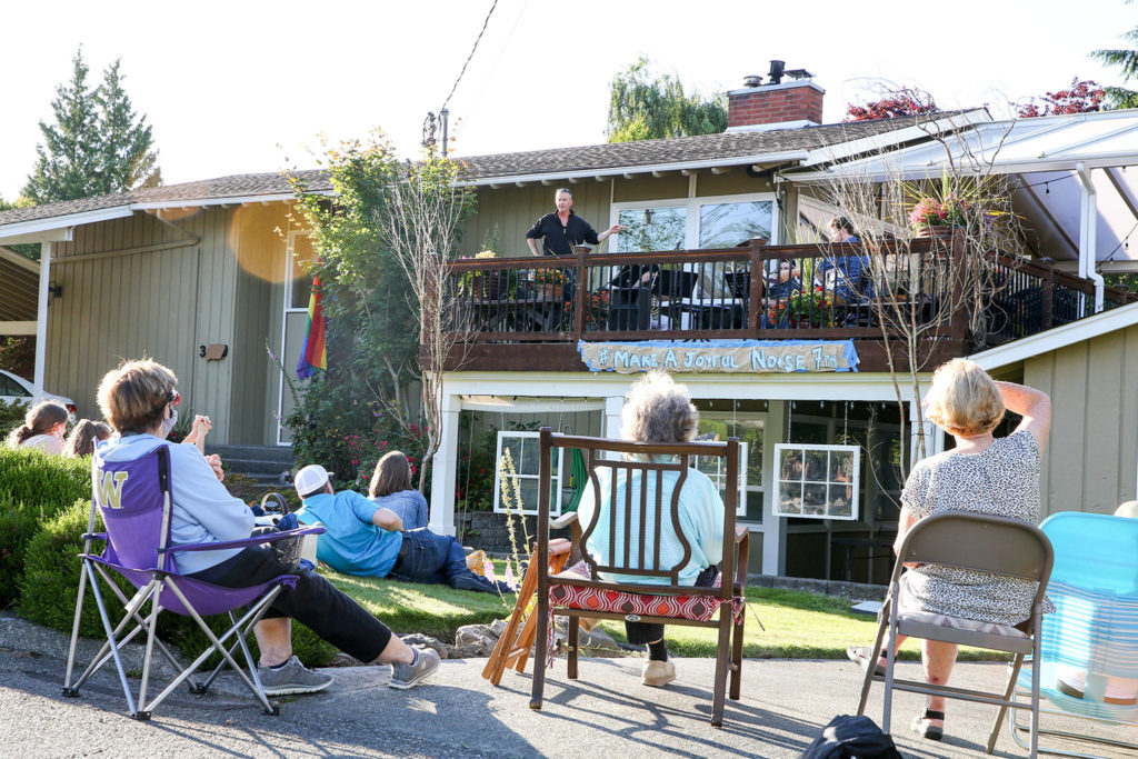 Jake Bergevin introduces musicians during the Thursday night concert in Everett on June 25, 2020. (Kevin Clark / The Herald)
