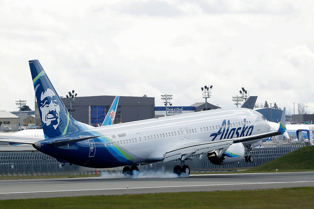 In this March 23 photo, an Alaska Airlines Boeing 737-9 Max lands at Paine Field near Boeing’s manufacturing facility in Everett. U.S. regulators are requiring inspections and possible repairs to engine coverings of all Boeing 737 Max jets because of a problem that could lead to loss of engine power. (AP Photo/Ted S. Warren, File)