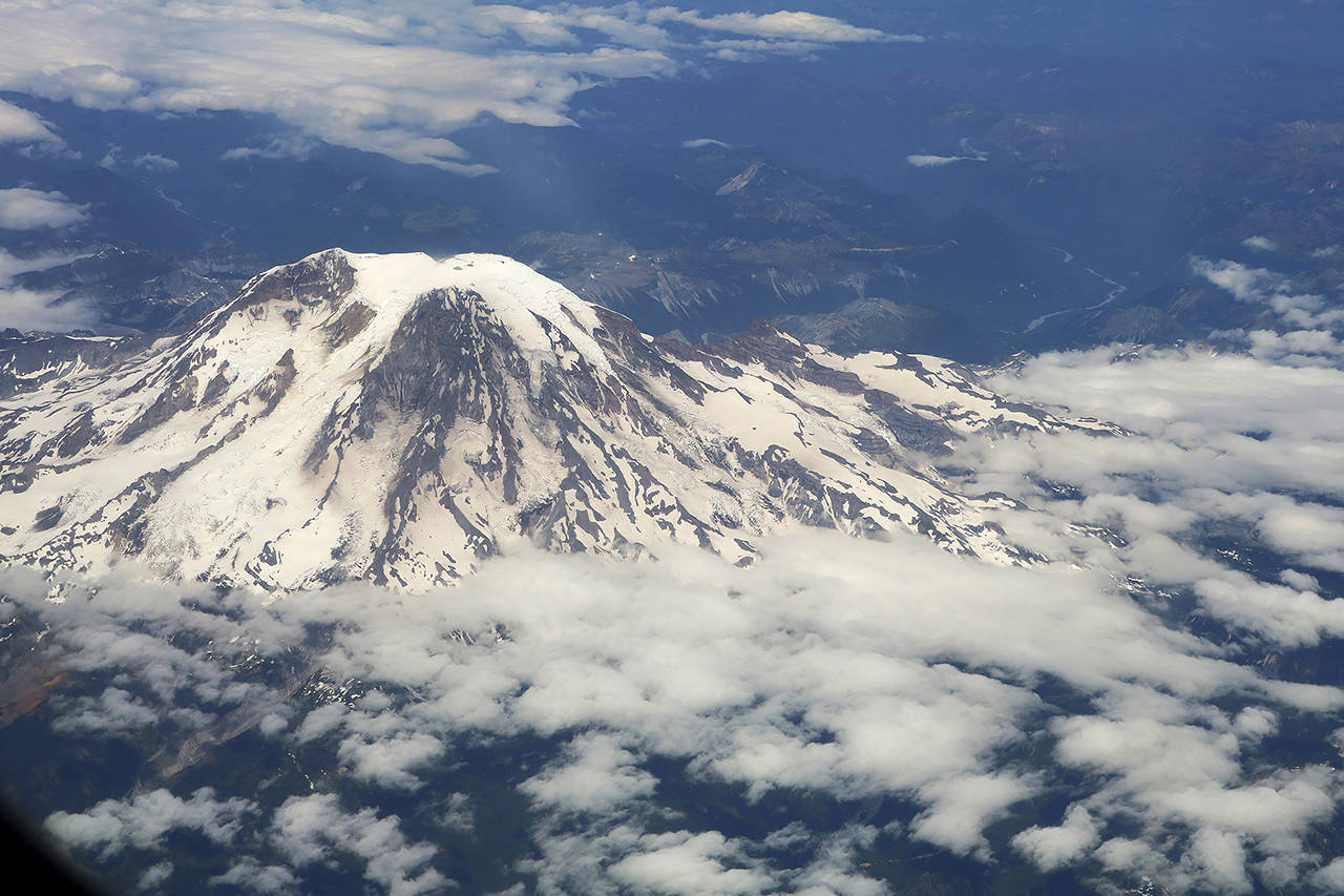 In this July 2018 photo, Mt. Rainier is seen in an aerial image. (AP Photo/Ritu Shukla, file)