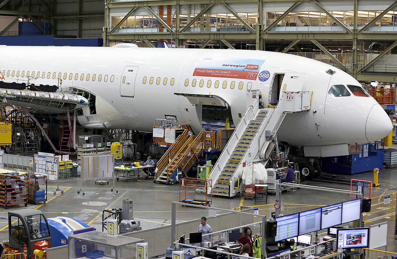 This 2017 photo shows a Boeing 787 being built for Norwegian Air Shuttle at Boeing Co.’s assembly facility in Everett. (AP Photo/Ted S. Warren, File)