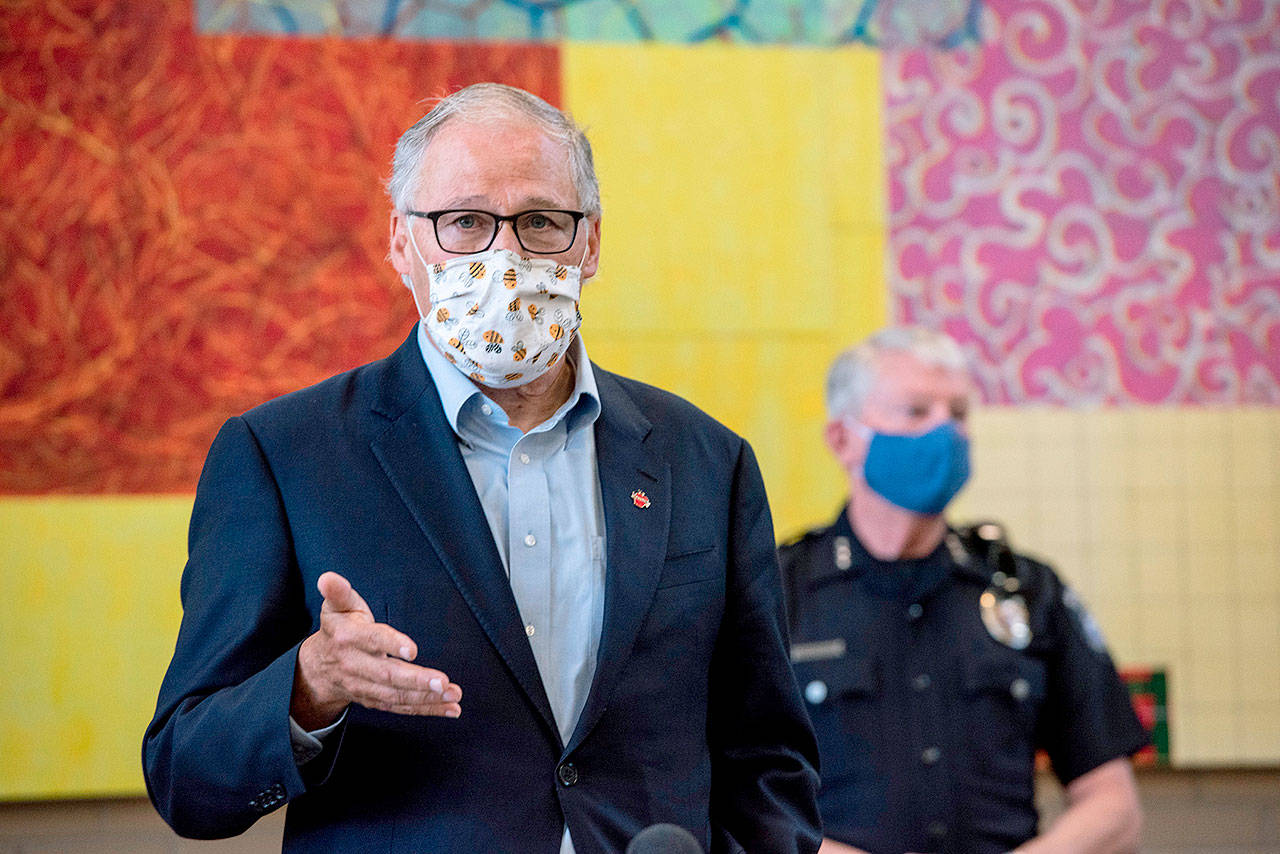 Washington Gov. Jay Inslee speaks at Columbia Basin College in Pasco on Tuesday about the spread of the coronavirus in Benton and Franklin counties. (Jennifer King/The Tri-City Herald via AP)