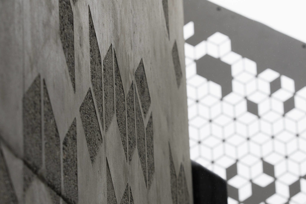 Concrete details match the hand rails at the Grand Avenue Park Bridge on Wednesday in Everett. The city expects the walkway to open for use this summer. (Andy Bronson / The Herald)
