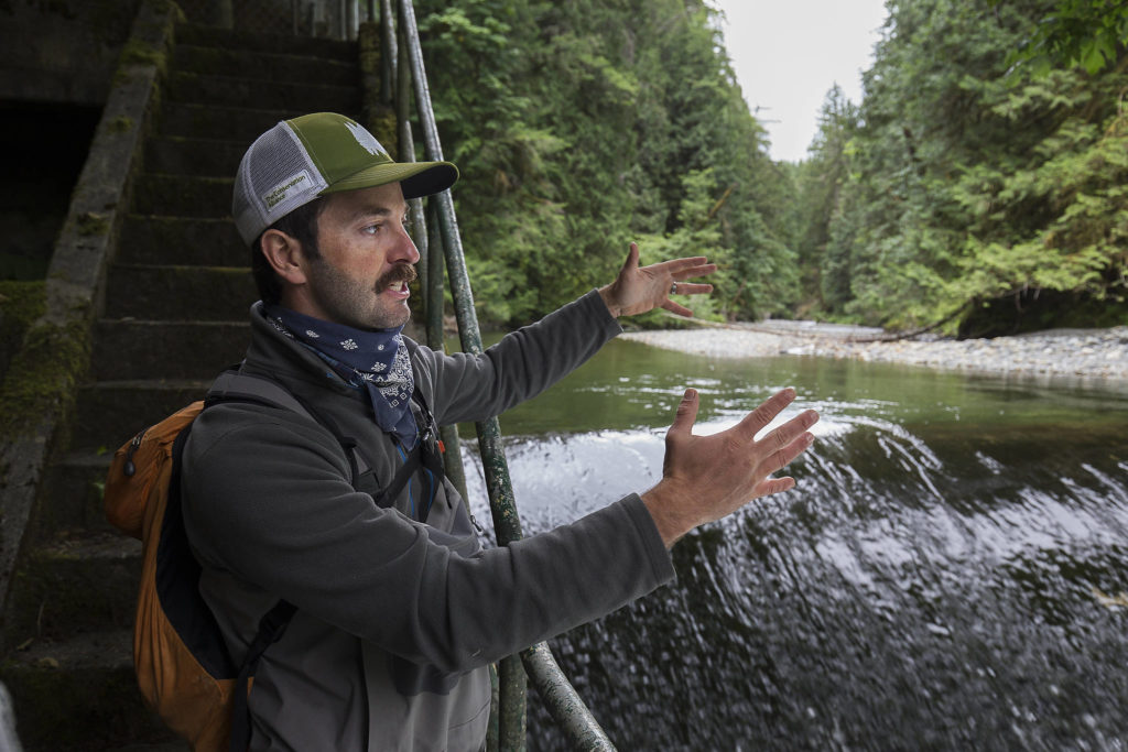 Brett Shattuck, a restoration ecologist with the Tulalip Tribes, at the Pilchuck River in Granite Falls. (Andy Bronson / The Herald) 
