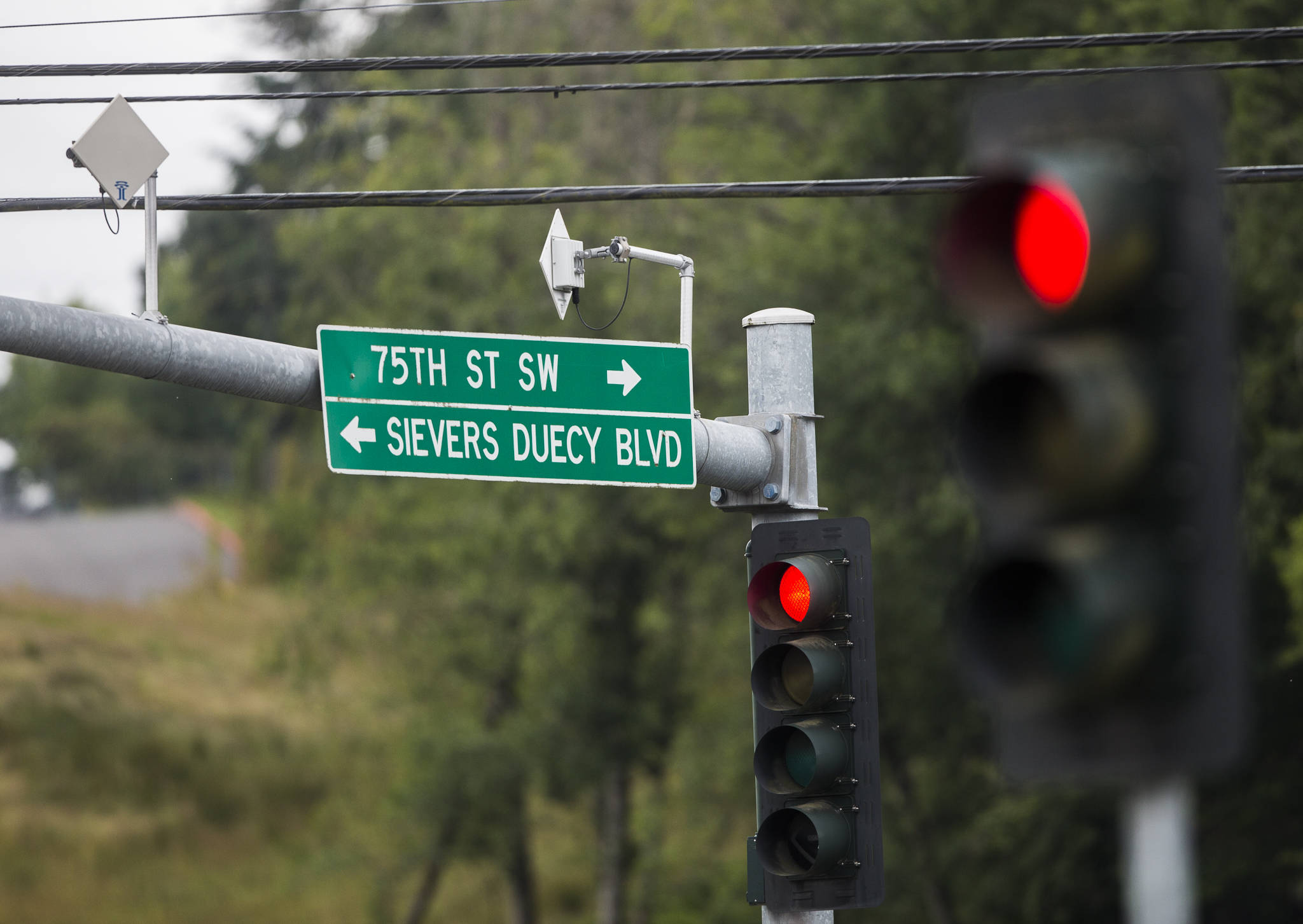 Wireless transmitters that send traffic data to the city’s traffic management center can be seen on the corner of Hardeson Road and 75th Street SW on Thursday in Everett. (Olivia Vanni / The Herald)