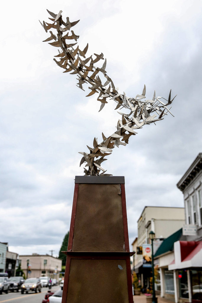 Kevin Pettelle’s “Wagner Swifts” sculpture stands at the corner of Main and Lewis streets in Monroe. (Kevin Clark / The Herald)
